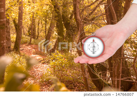 Composite image of businesswomans hand presenting 14766807