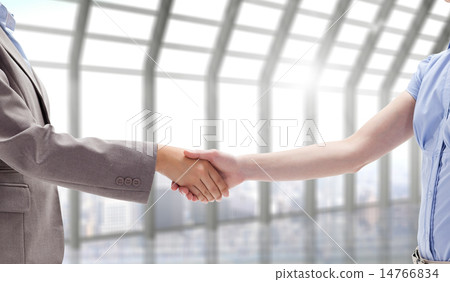 Composite image of handshake between two women Composite image of handshake between two women 14766834