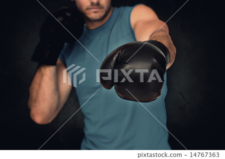 Composite image of close-up of a determined male boxer focused o Composite image of close-up of a determined male boxer focused o 14767363