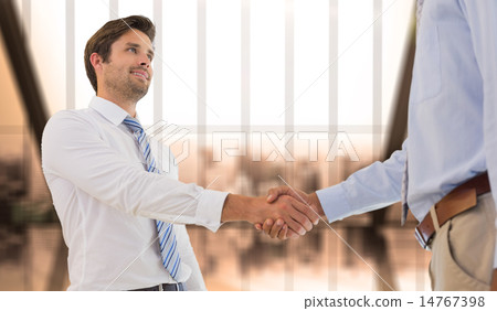 Composite image of young businessmen shaking hands in office 14767398