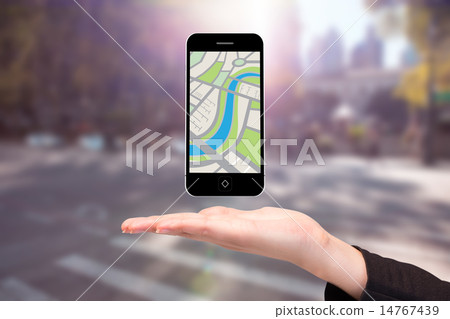Composite image of hand showing map app on phone 14767439
