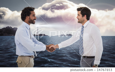 Composite image of smiling young businessmen shaking hands in of 14767853
