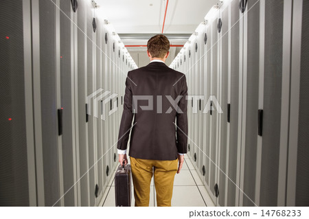 Composite image of young geeky businessman holding briefcase 14768233