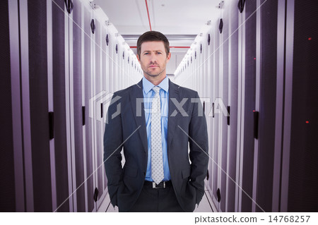 Composite image of businessman looking at the camera 14768257
