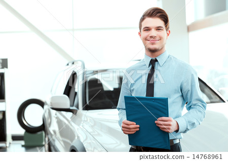 Handsome young man in dealership  14768961