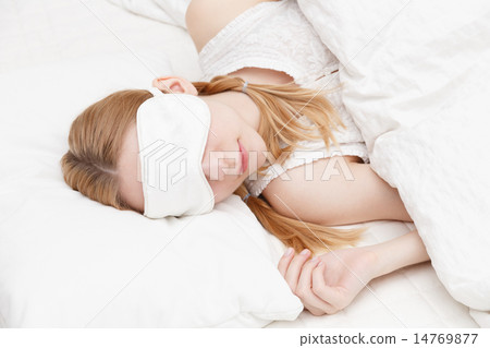 Sleeping young white woman 14769877