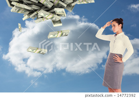Composite image of focused businesswoman 14772392