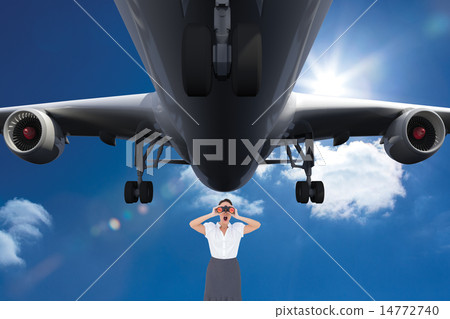 Composite image of shocked elegant businesswoman looking through binoculars Composite image of shocked elegant businesswoman looking through binoculars 14772740