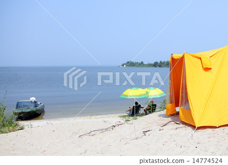 Rest near the river Dnepr with tents and boat Rest near the river Dnepr with tents and boat 14774524