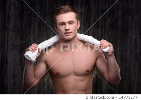 Young sporty man with towel after workout 14775177