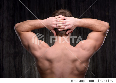 Close up of sporty man demonstrating back muscles Close up of sporty man demonstrating back muscles 14775189