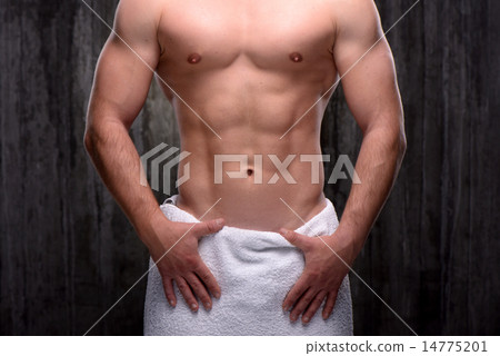 Close up of sporty man with towel on hips 14775201