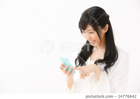 A young girl using a smartphone 14776642
