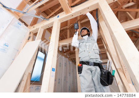 Carpentry working at home construction site 14778884