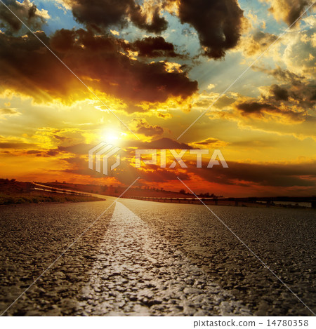 asphalt road and dramatic sunset over it 14780358