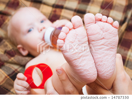 little baby drinking tea or juice from bottle little baby drinking tea or juice from bottle 14787330
