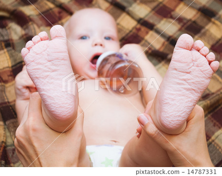 little baby drinking tea or juice from bottle little baby drinking tea or juice from bottle 14787331