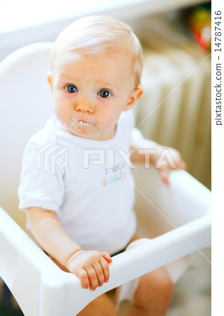 Eat smeared lovely baby in baby chair impressively looking Eat smeared lovely baby in baby chair impressively looking 14787416