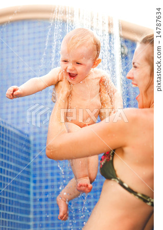 Young mother and happy baby taking shower Young mother and happy baby taking shower 14787634