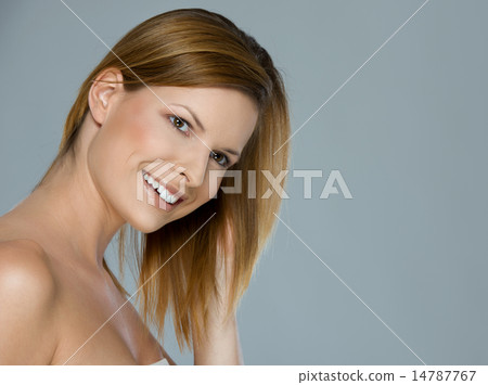 Beauty portrait of smiling girl isolated on gray 14787767