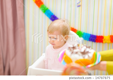 Upset baby on celebration of first birthday 14787875