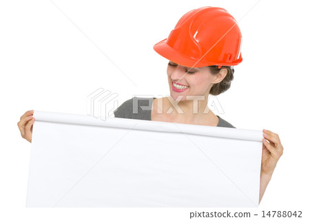 Smiling architect woman looking on blank flip chart isolated Smiling architect woman looking on blank flip chart isolated 14788042