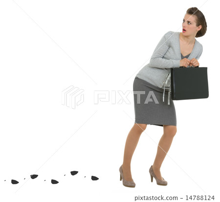Sneaking business woman with briefcase leaving trace 14788124