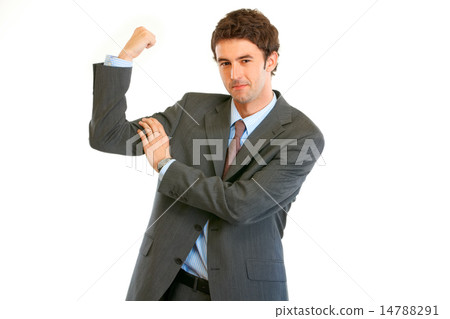 Confident young businessman showing his muscles. 14788291