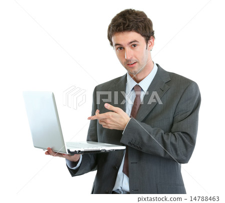 Surprised businessman pointing in laptop 14788463