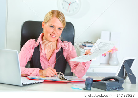 Happy business woman showing document Happy business woman showing document 14788628