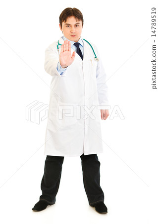 Authoritative medical doctor showing stop gesture. 14789519