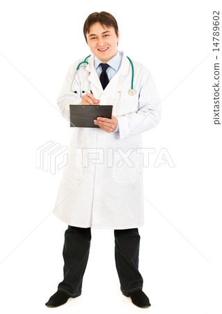 Smiling doctor with stethoscope making notes in medical chart. 14789602