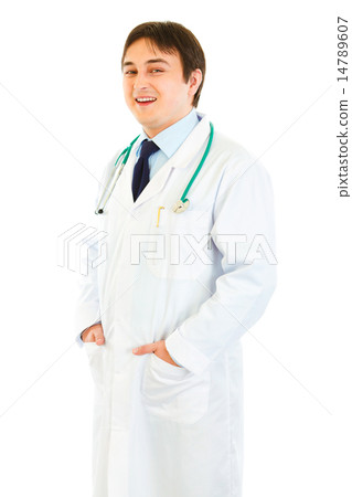 Smiling medical doctor with hands in pockets . 14789607