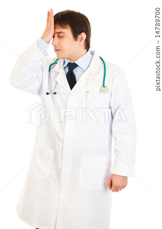 Forgot something medical doctor holding his hand near forehead. Forgot something medical doctor holding his hand near forehead. 14789700