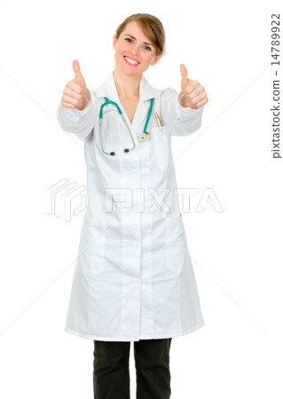 Smiling medical doctor woman showing thumbs up gesture. Smiling medical doctor woman showing thumbs up gesture. 14789922