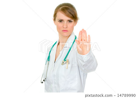 Strict medical female doctor showing stop gesture. 14789990