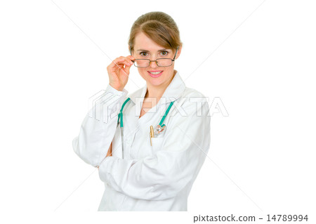 Smiling medical doctor woman with glasses interestedly looking at you. 14789994