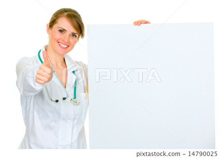 Smiling medical female doctor holding blank billboard and showing thumbs up gesture. Smiling medical female doctor holding blank billboard and showing thumbs up gesture. 14790025