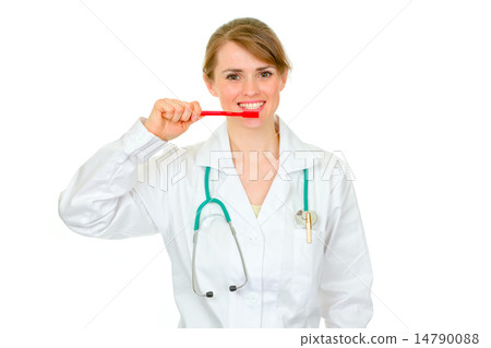 Medical doctor woman with toothbrush showing how to clean teeth 14790088