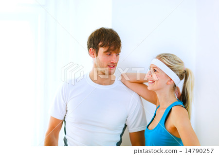 Portrait of handsome guy and pretty girl in sportswear Portrait of handsome guy and pretty girl in sportswear 14790257