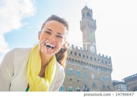 Happy young woman in front of palazzo vecchio in florence, italy Happy young woman in front of palazzo vecchio in florence, italy 14790647