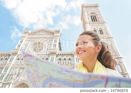 Happy young woman with map in front of duomo in florence, italy Happy young woman with map in front of duomo in florence, italy 14790859
