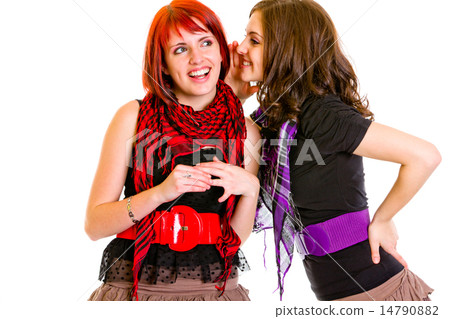 Girl whispering gossips in ear her interested girlfriend. Girl whispering gossips in ear her interested girlfriend. 14790882