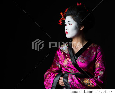 Portrait of geisha looking on copy space isolated on black 14791027
