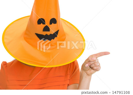 Woman in Halloween hat over head pointing on copy space Woman in Halloween hat over head pointing on copy space 14791108