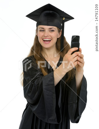 Happy graduation girl making self photo by phone Happy graduation girl making self photo by phone 14791109