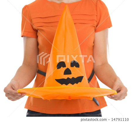 Closeup on Halloween hat holding by woman Closeup on Halloween hat holding by woman 14791110