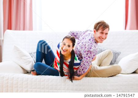 Happy young couple having fun at home 14791547