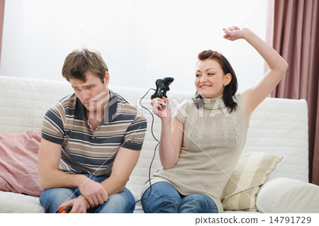Girl rejoicing that beat boyfriend in console 14791729