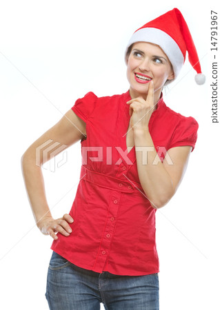Thoughtful young woman in Christmas hat looking on copy space Thoughtful young woman in Christmas hat looking on copy space 14791967